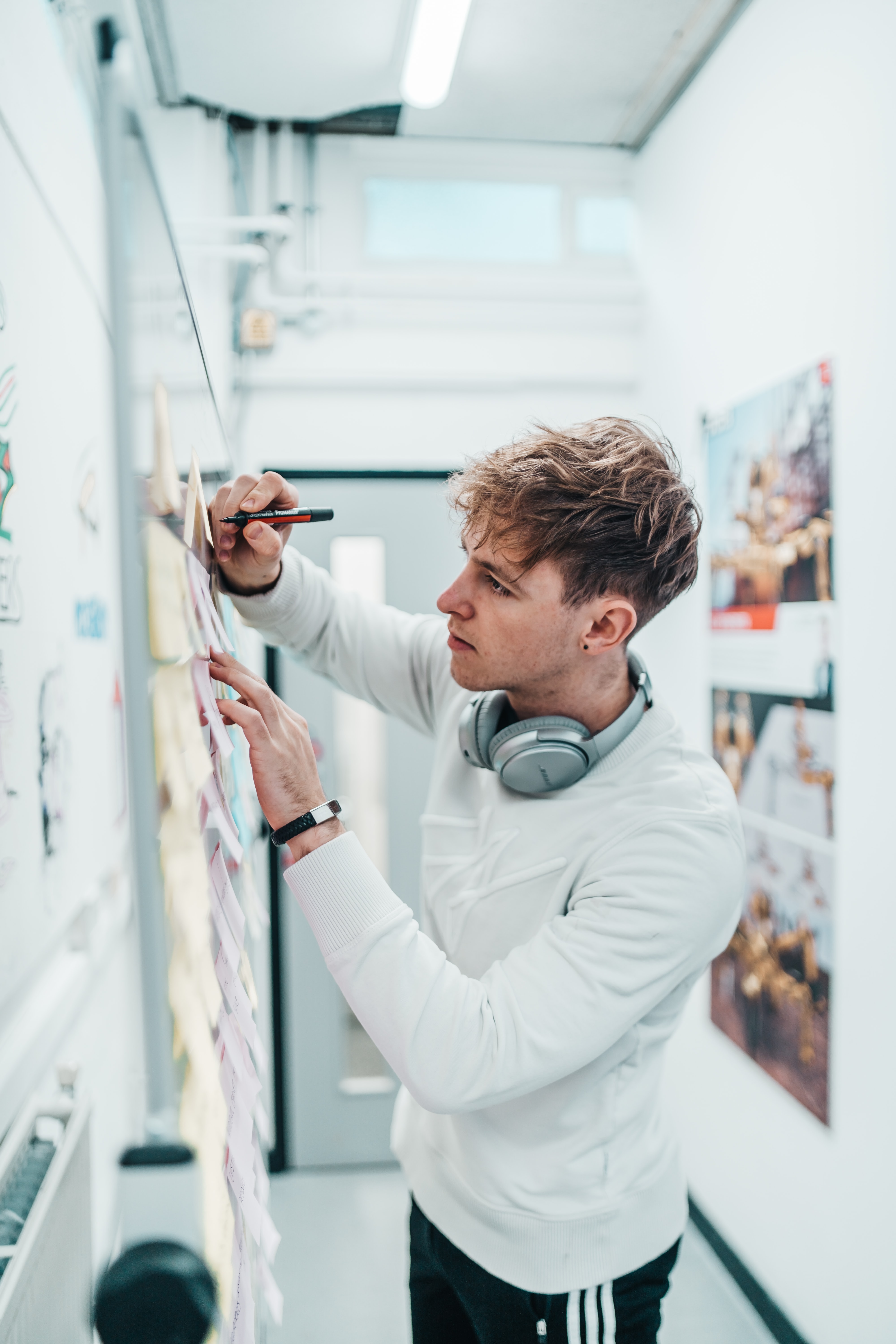 guy writing on postits